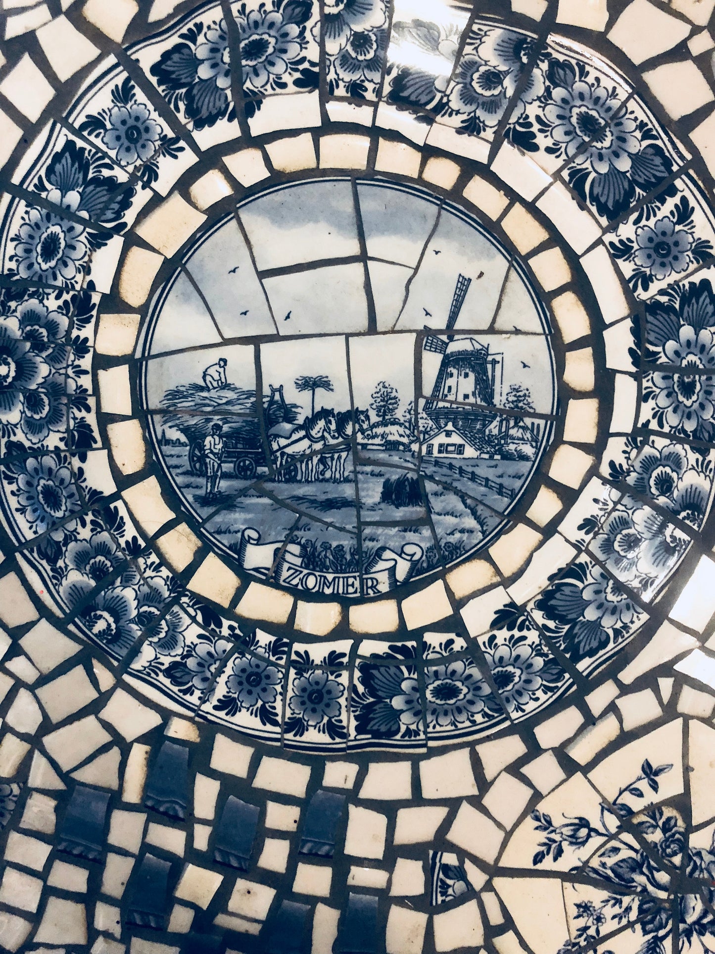 Mosaic cafe table on a wrought iron base. Blue Willow china. Broken Ceramic tiles. Gift idea for garden lover.