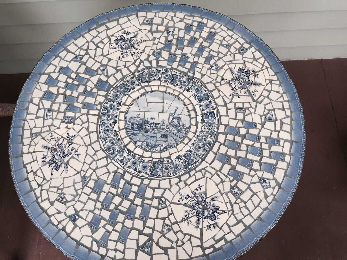 Mosaic cafe table on a wrought iron base. Blue Willow china. Broken Ceramic tiles. Gift idea for garden lover.