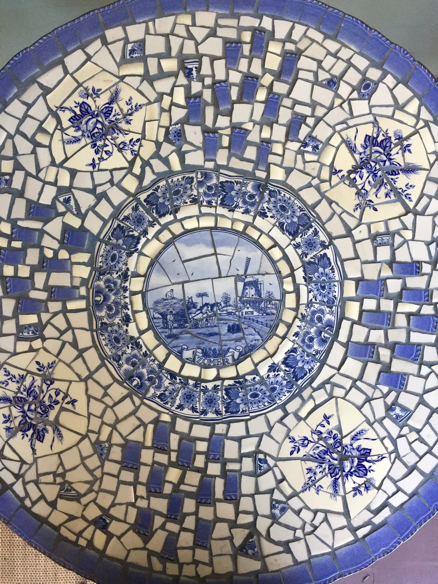 Mosaic cafe table on a wrought iron base. Blue Willow china. Broken Ceramic tiles. Gift idea for garden lover.