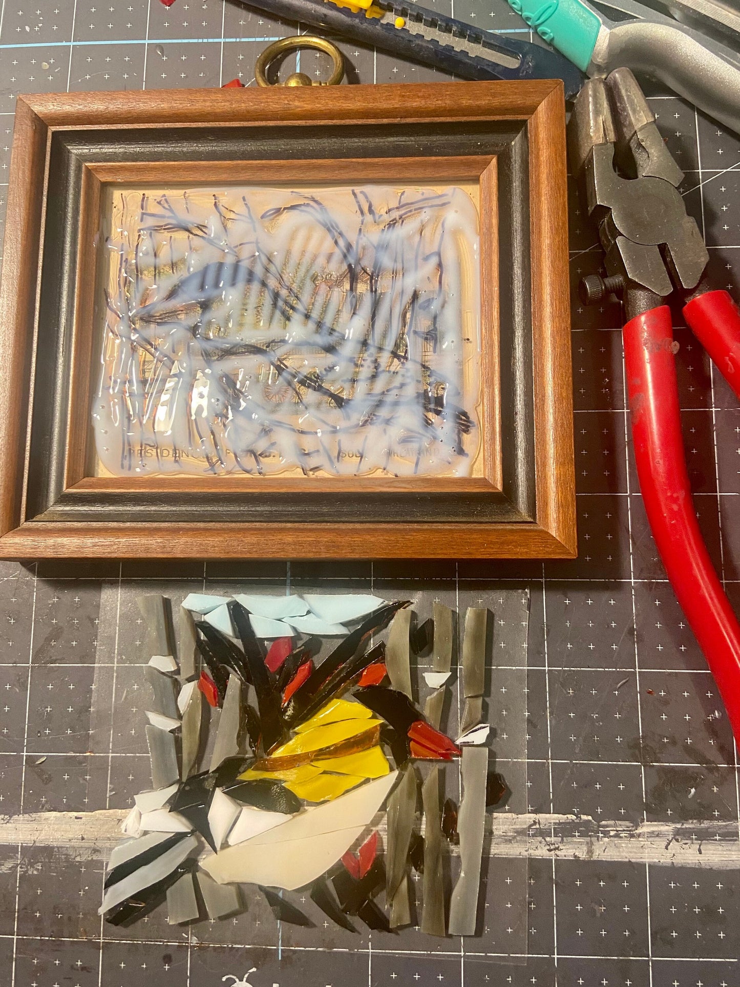 Handheld framed stained glass mosaic bird. Small 5"x5" Finch sitting on a tree branch. Gift for a bird watcher. Abstract bird wall art.
